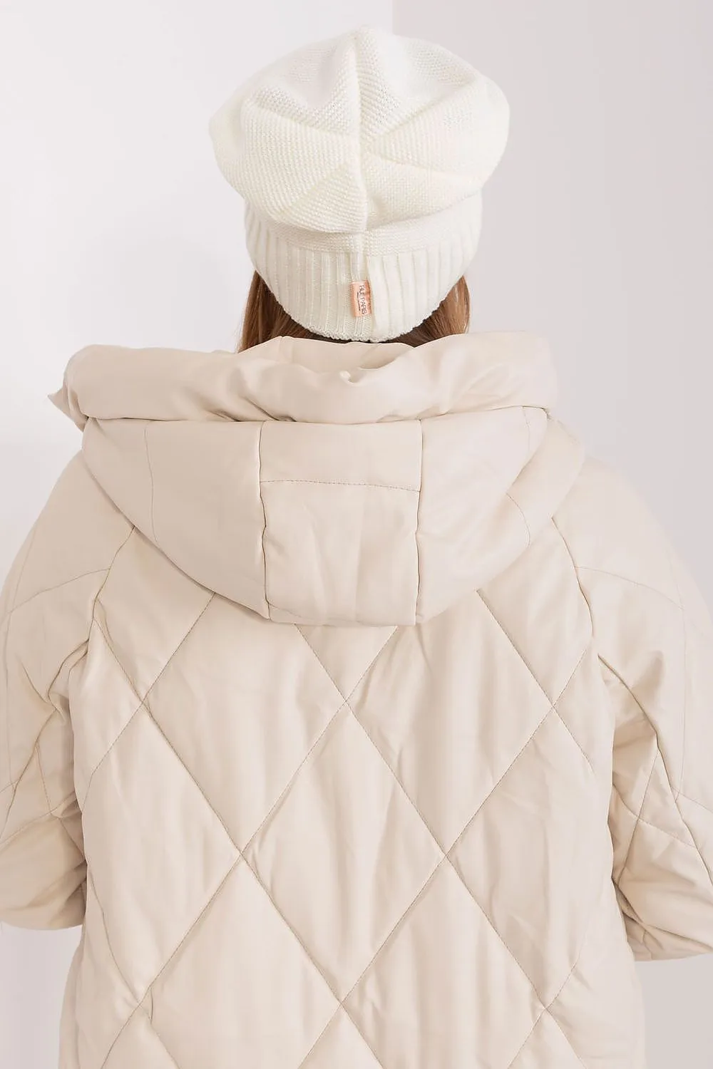 Women's winter hat with a smooth texture