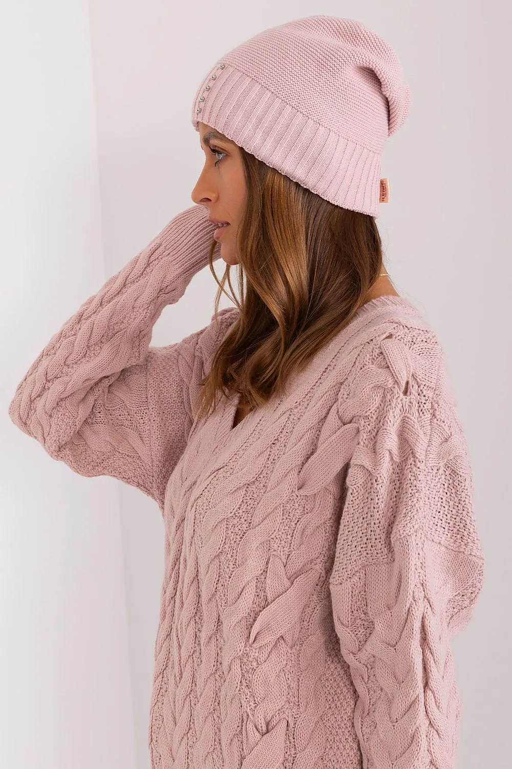 Women's winter hat with a smooth texture