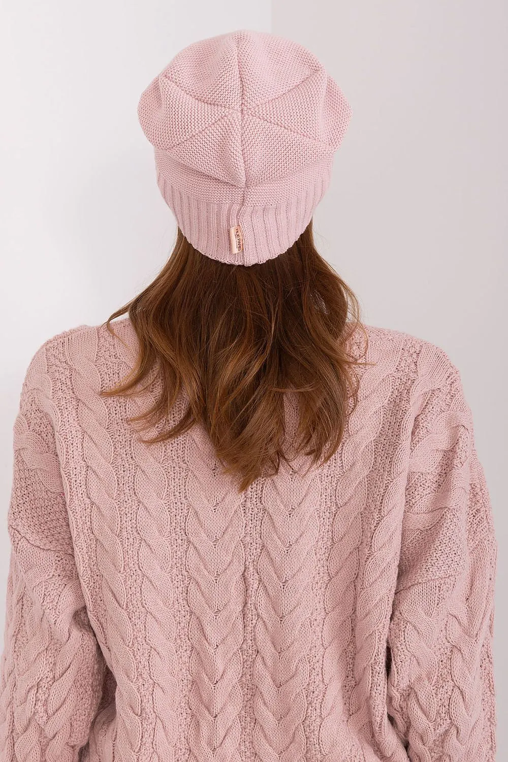 Women's winter hat with a smooth texture