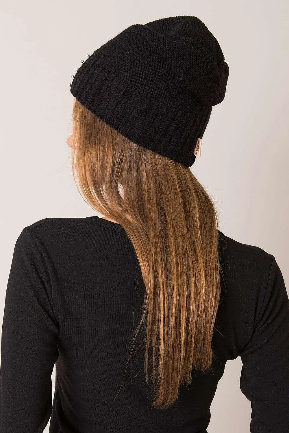 Women's winter hat with a smooth texture